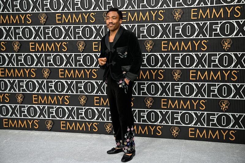 Donald Glover's embroidered velvet black suit was paired with ballet flats for the ceremony. Photograph: Robyn Beck/AFP via Getty Images