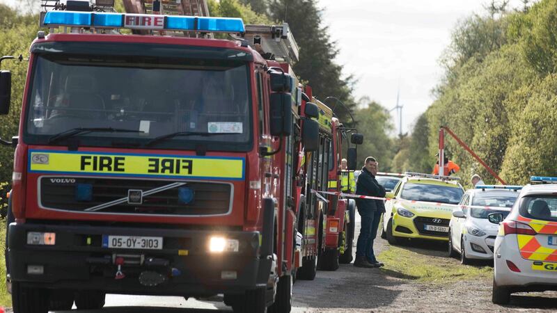 Emergency services at the scene of the crash of a light aircraft near Clonbullogue, Co Offaly, on Sunday. Photograph: Eamonn Farrell/RollingNews.ie
