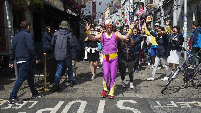 A silent disco walking tour of Galway is not for the self-conscious. People smiled and laughed and photographed our dancing horde led by the purple-synthetic-jumpsuited Australian host. Photograph: Andrew Downes/ xposure