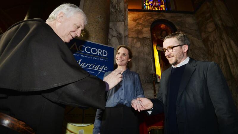 Father Bernard Murphy, curate at Our Lady of Mount Carmel, Whitefriar Street Church, blessing engaged couple Helen Young and Conor Kavanagh, from Rathfarnham and Harold’s Cross at the Shrine of S Valentine in the church.  Photograph: Alan Betson/The Irish Times