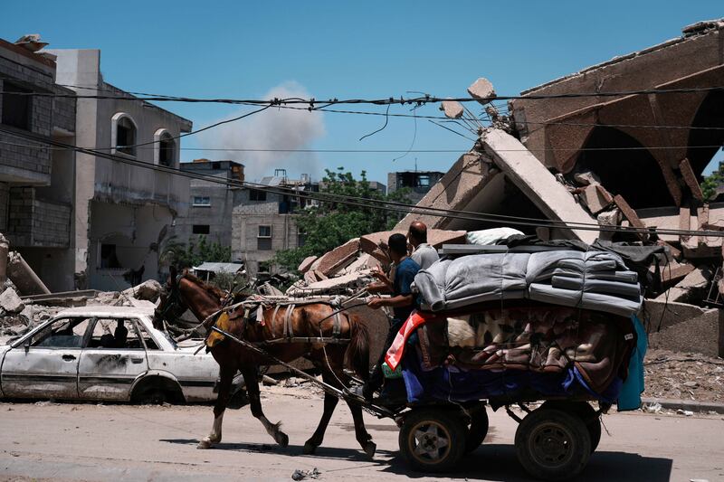 Smoke rises to the sky following an Israeli air strike. Photograph: Jehad Alshrafi/AP