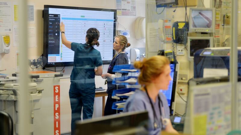 Geraldine McMahon, senior ED consultant, with medic Cliona O’Byrne  in front the patient information  screen. Photograph: Alan Betson