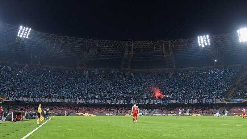 Napoli supporters wave flags during their Europa League meeting with Arsenal last season. Photo: Francesco Pecoraro/Getty Images