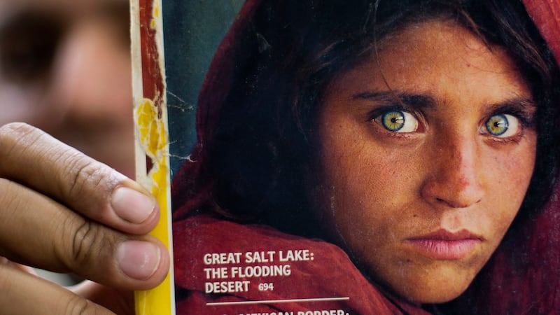 Sharbat Gula on the cover of National Geographic 30 years ago: she became a symbol of her country’s internecine wars when her photo as a young girl with haunted eyes appeared on the cover of National Geographic. Photograph: AP Photo/BK Bangash