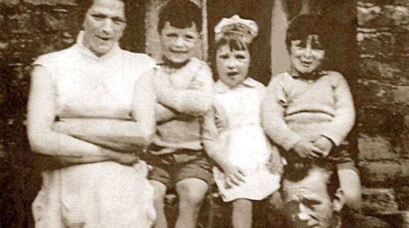 Nearly all  photographs of the McConville family were lost when the children were put into care. This surviving photograph features  Jean McConville with  her  husband  Arthur, and children Archie, Robert and Helen. Photograph:  Alan Lewis