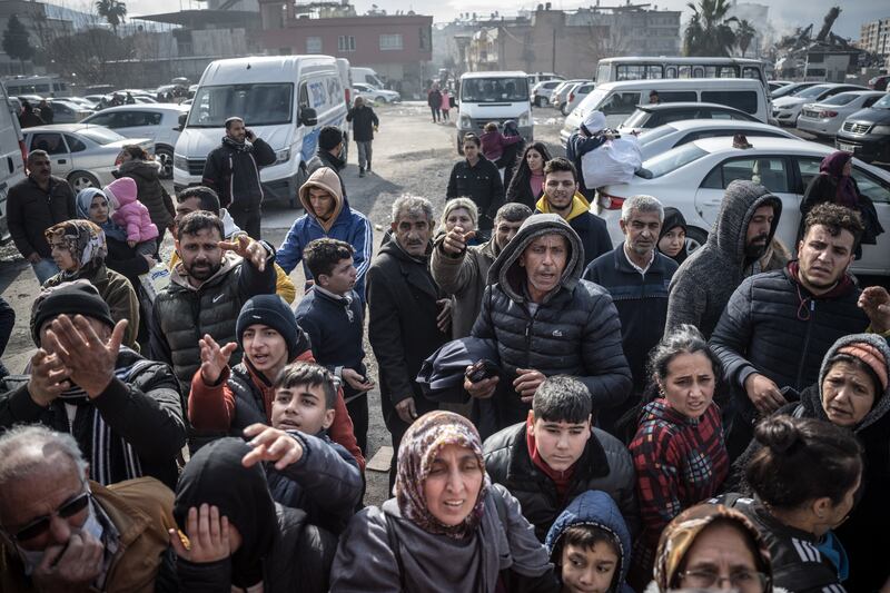 Earthquake survivors await the distribution of donated clothing  in Iskenderun, Turkey. Photograph: Sergey Ponomarev/New York Times