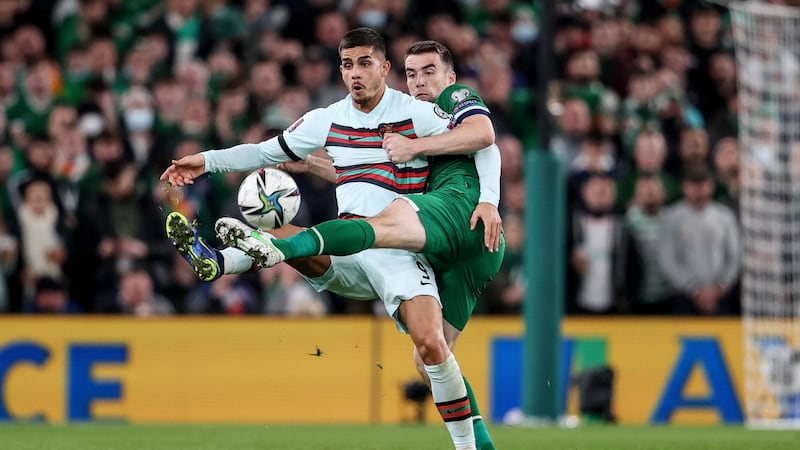 Ireland’s Séamus Coleman challenges Andre Silva of Portugal during the World Cup qualifier. Photograph: Dan Sheridan/Inpho