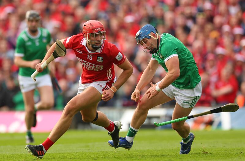 Cork's Brian Hayes takes on Limerick's Mike Casey during the Munster SHC final. Photograph:
James Crombie/Inpho