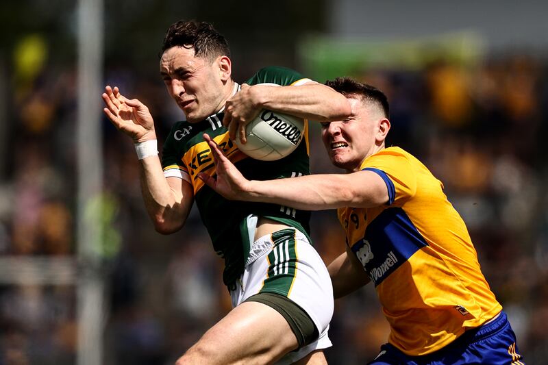 Kerry's Paudie Clifford is tackled by Brian McNamara of Clare in the Munster SFC final at Cusack Park, Ennis. Photograph: Ben Brady/Inpho