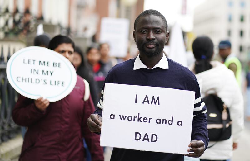 Nurudeen Oyewole (40), a Dublin area social worker from Nigeria, takes part in a Families Belong Together campaign demonstration outside the Department of Justice in Dublin on Wednesday. Photograph: Brian Lawless/PA Wire 