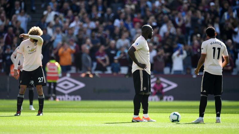 United’s players react after conceding in the defeat to West Ham. Photo: Andy Rain/EPA
