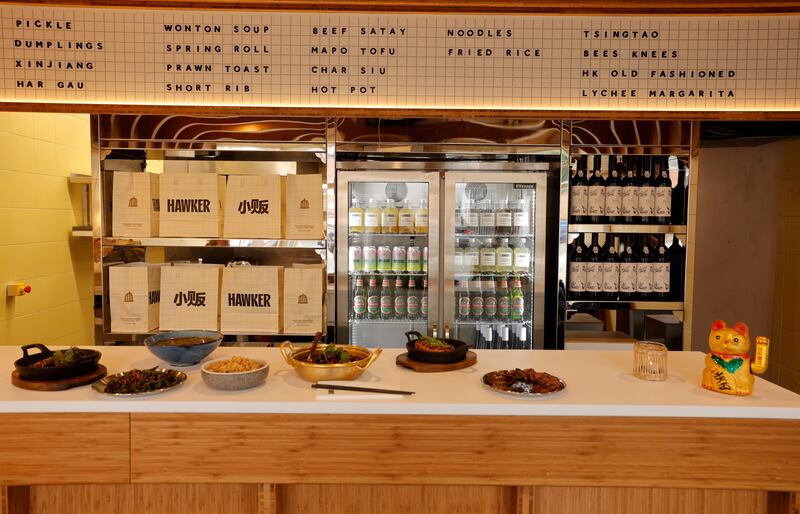 Hawker features a retro menu board, in keeping with the brand design which combines bold black characters against a cream and gold background