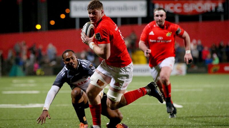 Munster’s Jack O’Donoghue  shakes off the challenge of  Andell Loubser of Southern Kings on his way to scoring a try dueing the Guinness Pro 14 game at Musgrave Park. Photograph: Tommy Dickson/Inpho