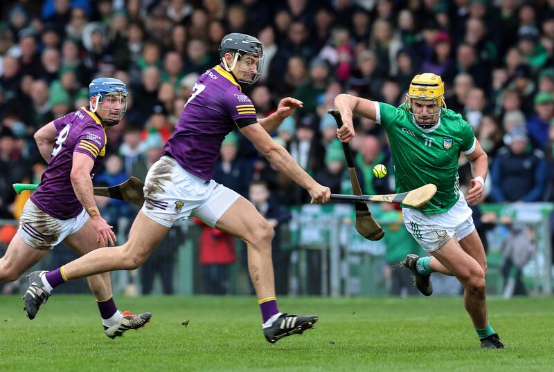 Limerick's Cathal O'Neill and Jack O'Connor of Wexford. Photograph: Lorraine O’Sullivan/Inpho