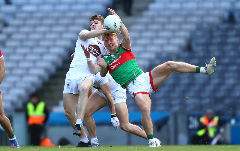 Kildare's Kevin Feely and Jack Carney of Mayo compete for possession at Croke Park. Photograph: Bryan Keane/Inpho