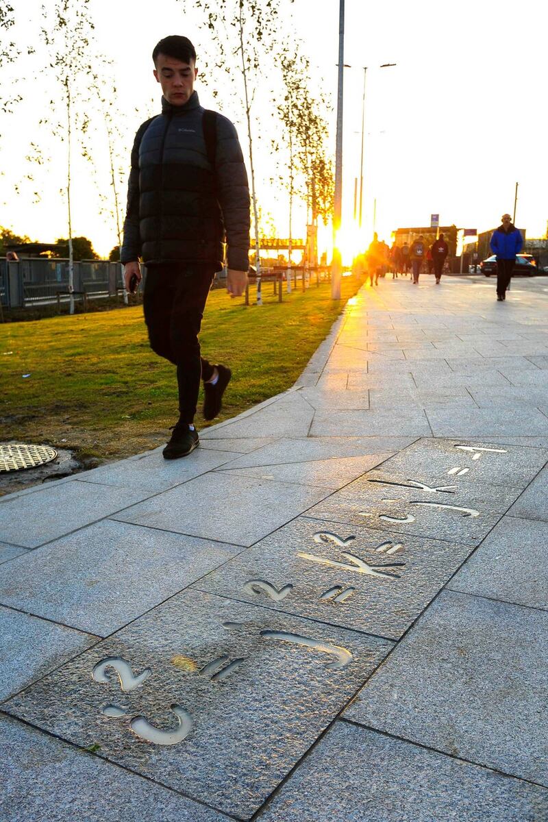 An artwork by tattoo artist Emma Ray at Broombridge Luas stop that celebrates an 1843 act of graffiti by William Rowan Hamilton, who scratched his formula for Quaternion algebra onto the bridge  with a penknife while  walking along the Royal Canal with his wife Helen. Photograph: Shane O’Neill/SON Photographic.