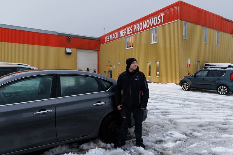 Alex Béland-Ricard stands outside Les Machineries Pronovost in St-Tite. Béland-Ricard grew up in the region and had not met an immigrant until he befriended Abdelkarim Othmani two years ago. Photograph: Nasuna Stuart-Ulin/New York Times