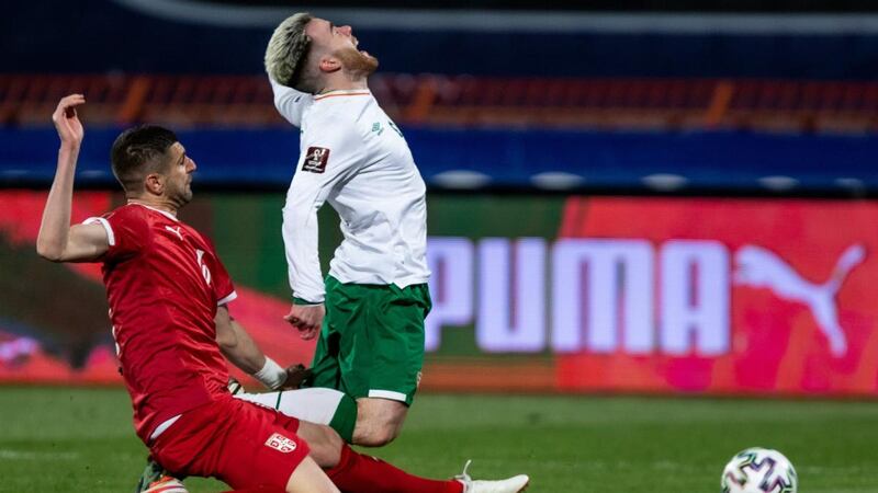 Aaron Connolly is tackled by Aleksandar Mitrovic during the World Cup qualifier in Belgrade. Photograph: Nikola Krstic/Inpho