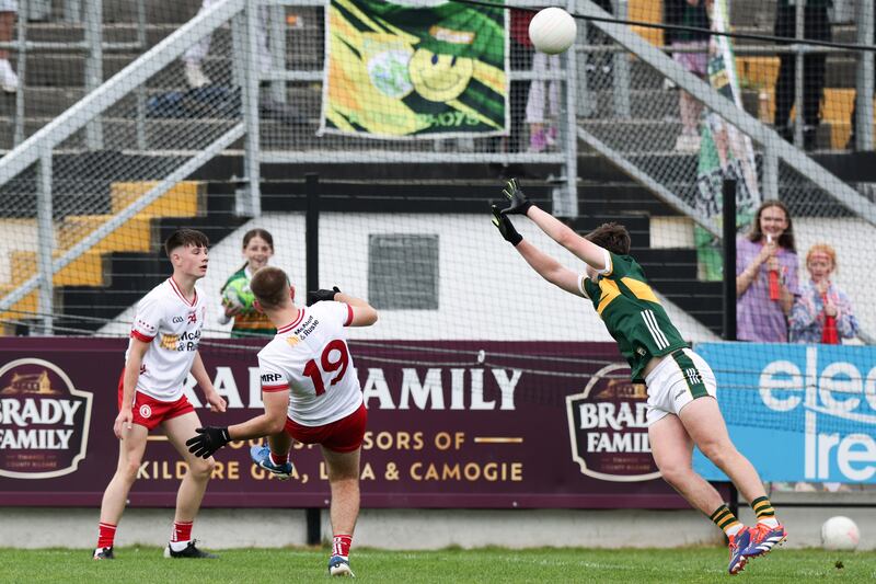 Diarmuid Martin shoots to score the winning point for Tyrone. Photograph: Tom Maher/Inpho