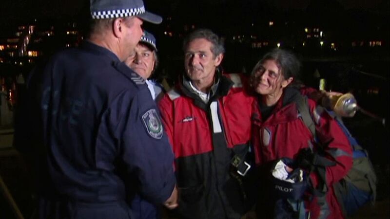 Nick Dwyer, second right, and Barbara Heftman, right, thank police rescuers in Sydney. Photograph: Australian Broadcasting Corporation/AP