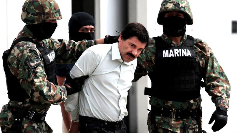 Mexican navy soldiers escort Joaquín “El Chapo” Guzmán after his arrest in Mexico City in 2014. Photograph: Jair Cabrera Torres/NurPhoto/Corbis via Getty Images