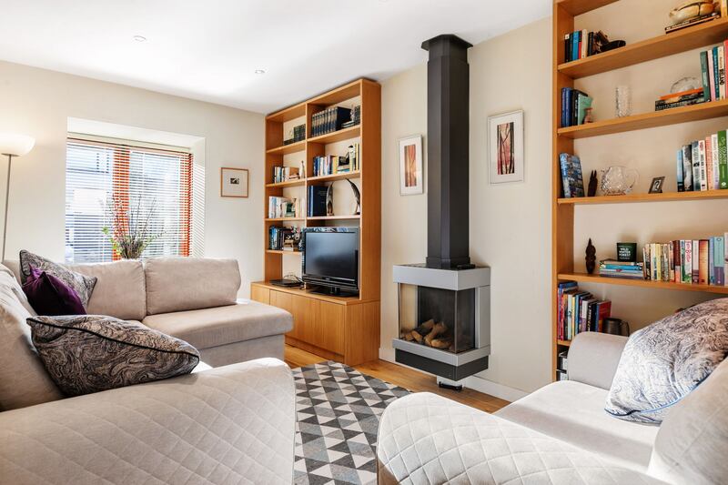 Sitting room with custom-built oak units