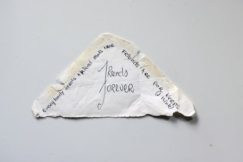 A note on an envelope flap from Trisha Lovett to Belinda Lee.
