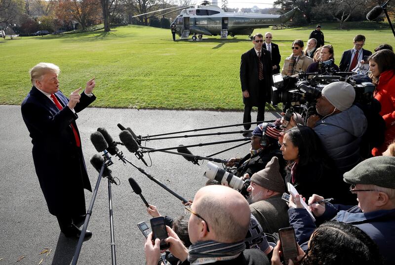 WASHINGTON, DC - NOVEMBER 29: U.S. President Donald Trump answers questions from the press while departing the White House November 29, 2018 in Washington, DC. Trump answered numerous questions regarding his former attorney Michael Cohen's recent court appearance and testimony before departing for the G-20 summit in Buenos Aires. (Photo by Win McNamee/Getty Images) *** BESTPIX ***