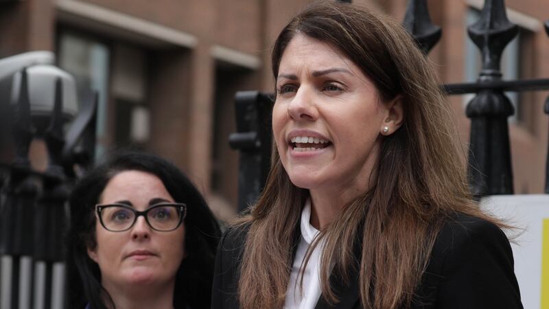 Catherine Duggan, wife of the late Liam Duggan,  with  her solicitor Rachael O Shaughnessy who spoke    to the media outside the Four Courts  following the settlement of her action for damages. Photograph: Collins Courts