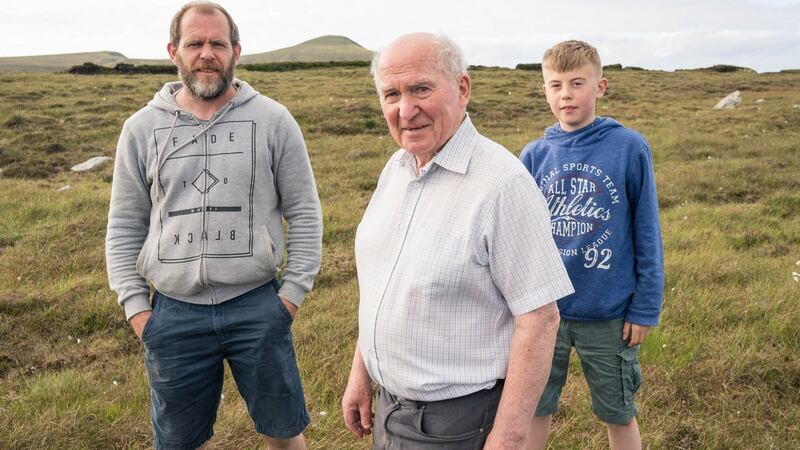 Archaeologist Seamus Caulfield with his son Declan and grandson Fionnán (12) at Belderrig, Co Mayo. Photograph: Keith Heneghan/Phocus