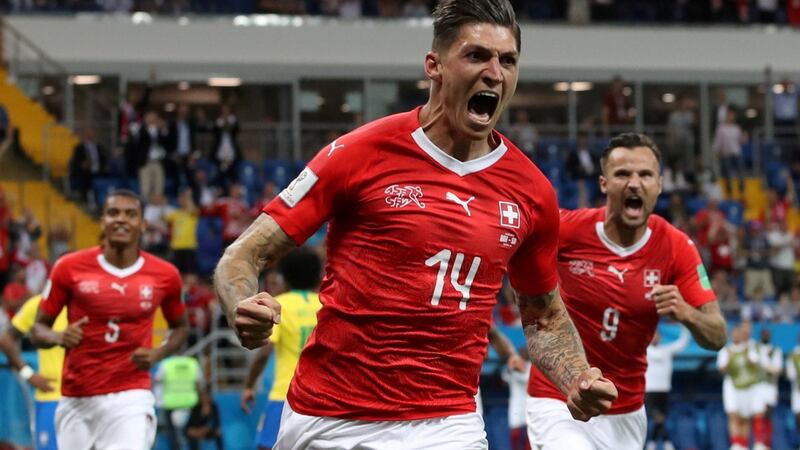 Switzerland’s Steven Zuber celebrates after scoring the equaliser. Photograph: Marko Djurica/Reuters