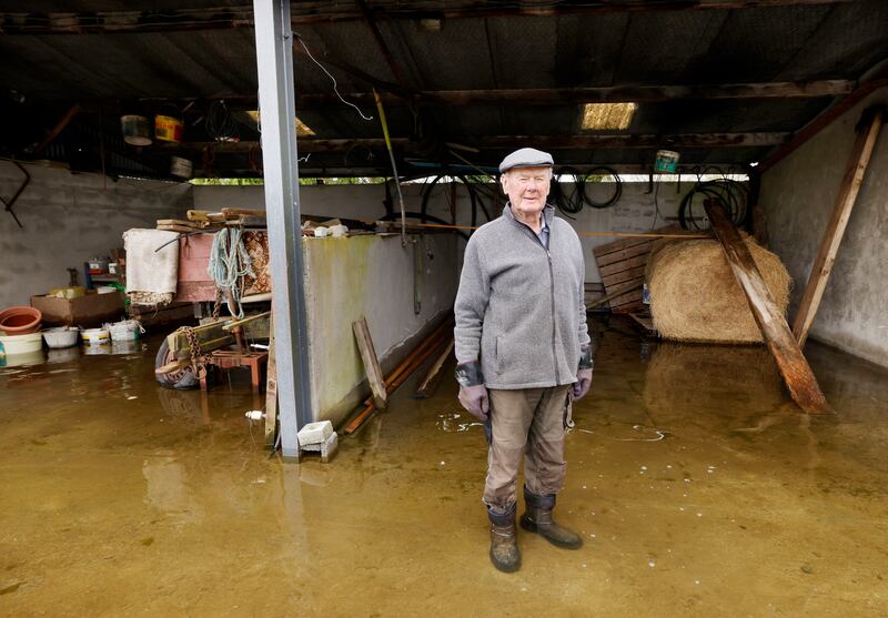 Barry Martin in his flooded yard. Photograph: Alan Betson/The Irish Times