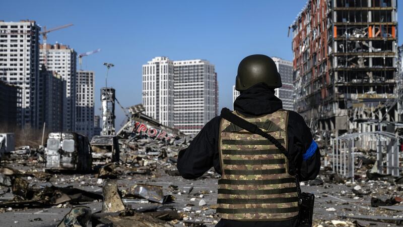 An emergency worker surveys the scene after the Retroville mall in Kyiv was obliterated by a Russian attack on March 21st. Photograph: Lynsey Addario/The New York Times