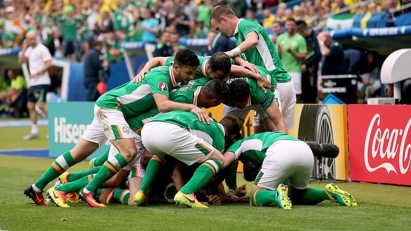 Hoolahan is buried under teammates after scoring the opener against Sweden in Euro 2016. Photo: Donall Farmer/Inpho