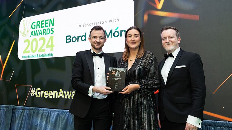 Jake Scully, director at Lumen Search, presents the green construction award to Stephen O'Shea and Nicola Cronin, Cairn