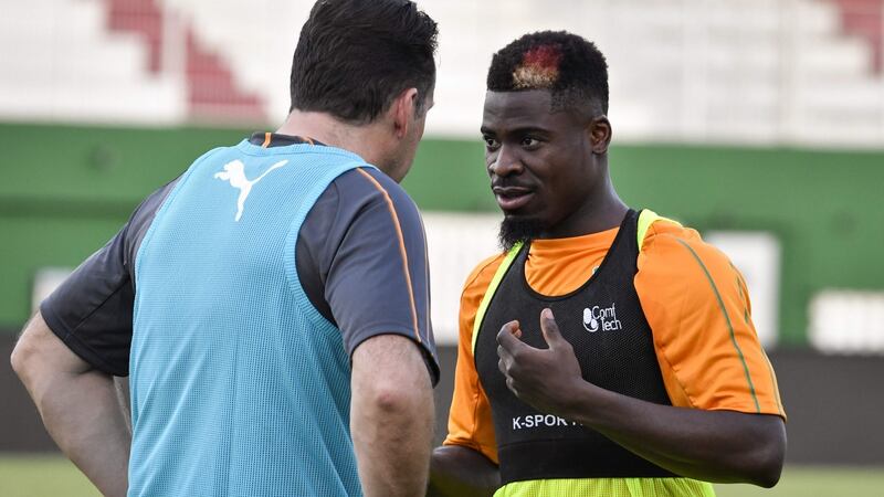 Ivory Coast boss Marc Wilmots and Tottenham’s Serge Aurier ahead of their crunch clash with Morocco. Photograph: Issouf/Sanogo/Getty