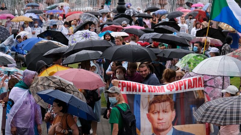 People carry a banner reading ‘Return Furgal for us’ during a protest against the arrest of regional governor Sergei Furgal in  Khabarovsk on August 1st. Photograph:  Aleksandr Yanyshev/AFP via Getty Images