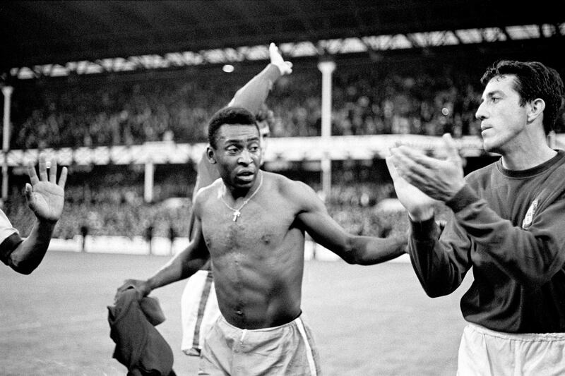 Brazil's Pele (left) congratulates Portugal's Jose Augusto (right) on his team's 3-1 win, which knocked Brazil out of the 1966 World Cup. Photograph: PA