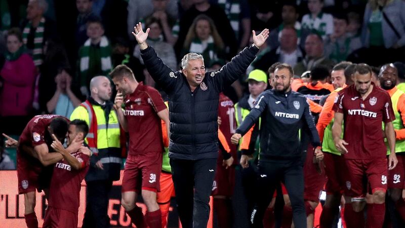 Cluj’s manager Dan Petrescu celebrates his side’s victory in Glasgow. Photograph: Jane Barlow/PA Wire