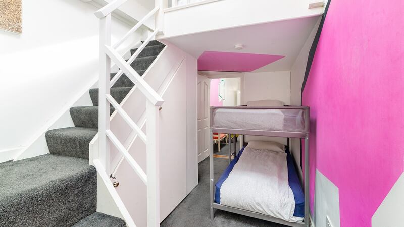 The property begins with a small entrance hall, next to which a bunk bed fits in behind a partition wall