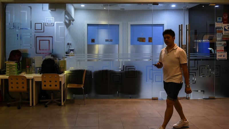 A pedestrian walks in front of a clinic where Kim Jong-Nam is believed to have been taken at Kuala Lumpur International Airport. Photograph: Mohd Rasfanmohd/AFP/Getty Images