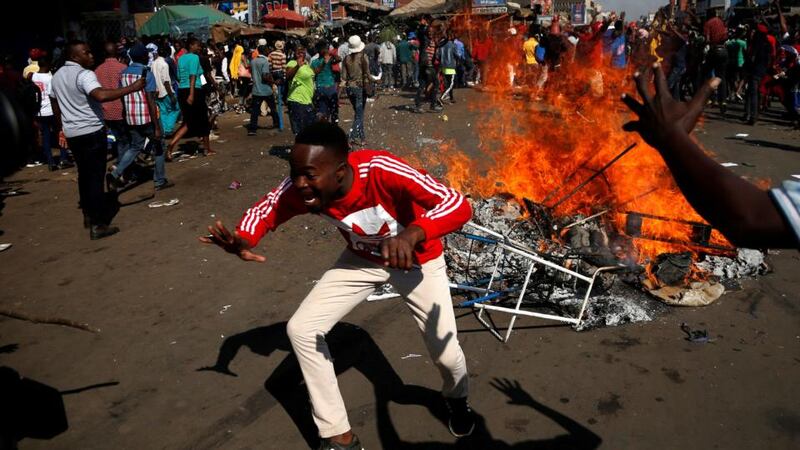 Supporters of the opposition Movement for Democratic Change party  of Nelson Chamisa on a street in Harare, Zimbabwe on Wednesday. Photograph:  Siphiwe Sibeko/Reuters