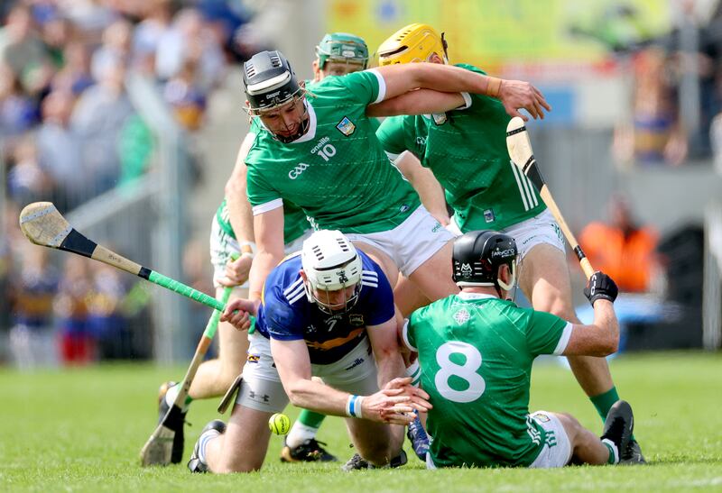 Limerick’s Gearoid Hegarty, Cathal O'Neill and Darragh O'Donovan tussle with Seamus Kennedy of Tipperary in Thurles on Sunday. Photograph: James Crombie/Inpho