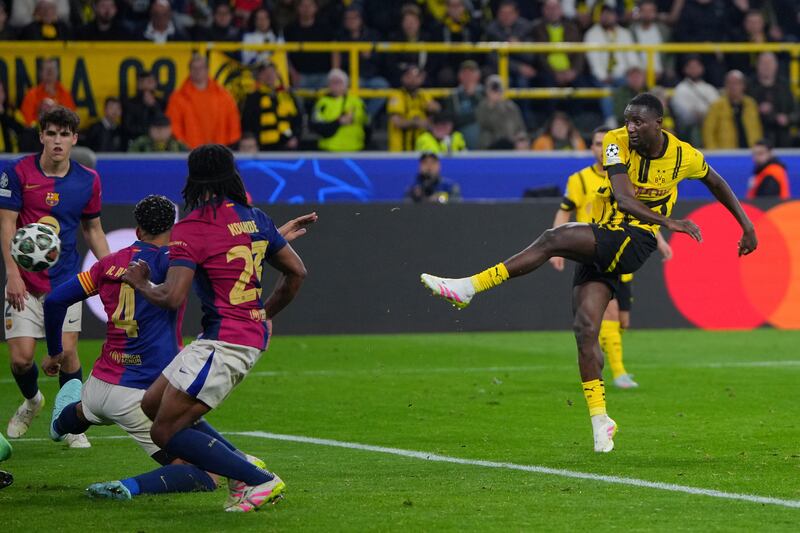 Borussia Dortmund striker Serhou Guirassy completes his hat-trick in the Champions League quarter-final, second leg against Barcelona at Signal Iduna Park. Photograph: Pau Barrena/AFP via Getty Images