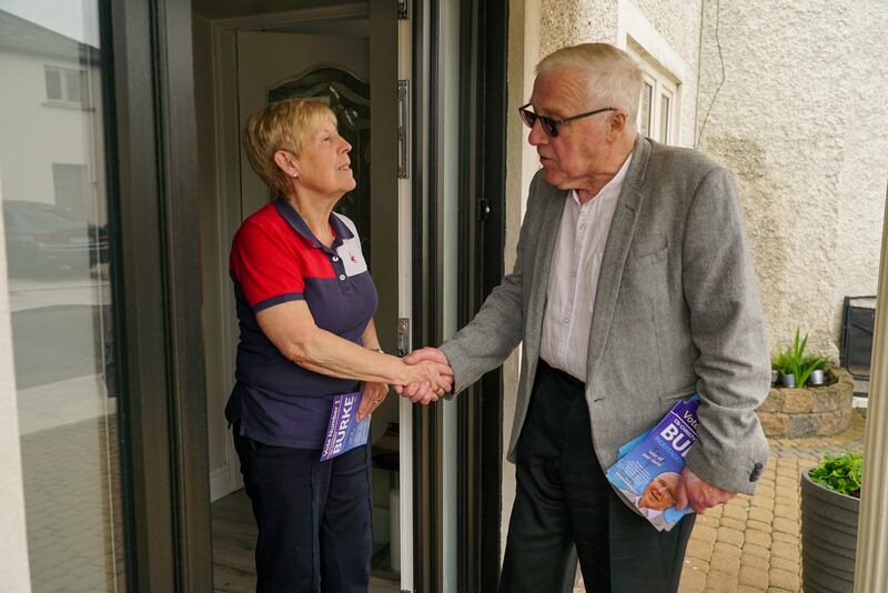 Moore Street fishmonger Margaret Hanway greets Christy Burke. Photograph: Enda O'Dowd