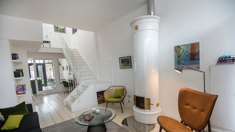 The living room with its contemporary stove looking down towards the kitchen on York Road, Dún Laoghaire. Photograph: Brenda Fitzsimons