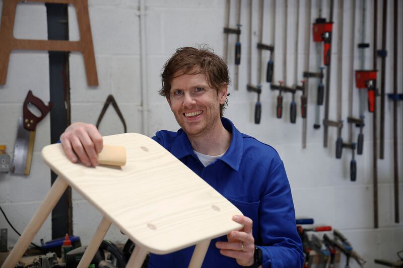 Conor in his workshop, which is adjacent to their home