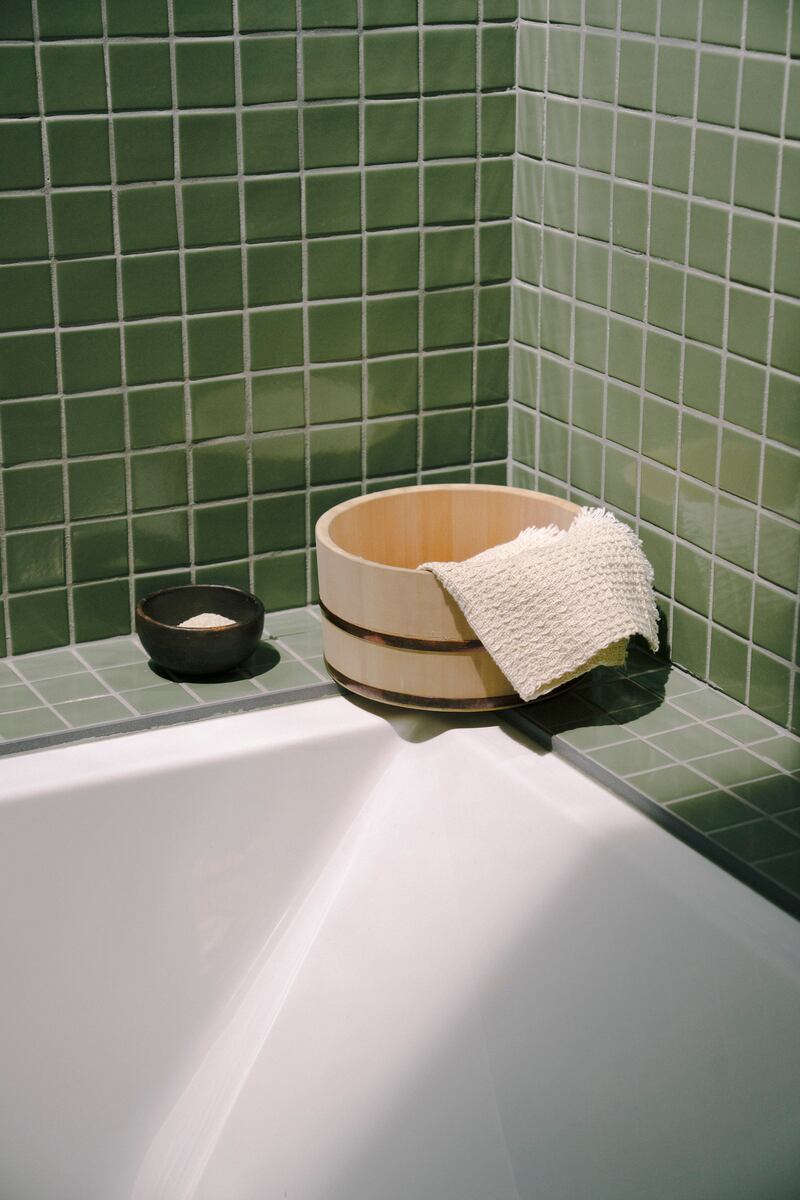 As she enters lifestyle territory, Marie Kondo suggests not just what clutter to remove from sight ('utilitarian bath and cleaning items'), but also what to add ('favourite bath salts or candles'). Photograph: Tess Comrie/ The New York Times