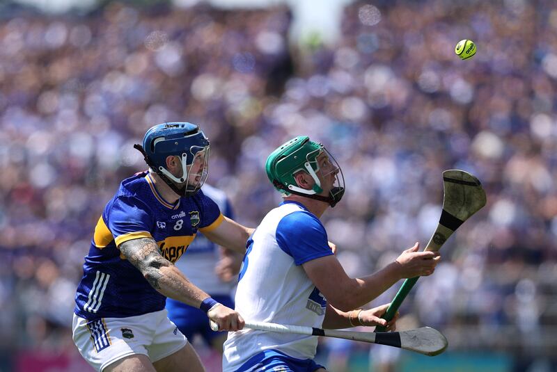 Tipperary's Willie Connors in action against Paddy Leavey of Waterford during the game in Thurles. Photograph: Bryan Keane/Inpho