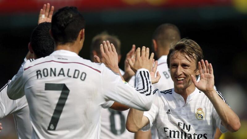 Cristiano Ronaldo celebrates his goal with team mate Luca Modric. Photograph: EPA